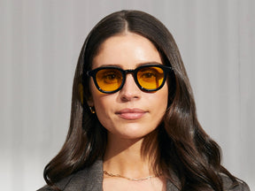 Model is wearing The DAHVEN in Black in size 47 with Mellow Yellow Tinted Lenses