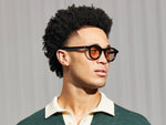 Model is wearing The DAHVEN in Black in size 47 with New York Rose Tinted Lenses
