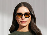Model is wearing The DAHVEN in Black in size 47 with Chestnut Fade Tinted Lenses