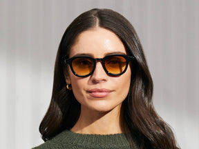 Model is wearing The DAHVEN in Black in size 47 with Chestnut Fade Tinted Lenses