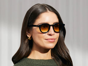 Model is wearing The DAHVEN in Black in size 47 with Chestnut Fade Tinted Lenses