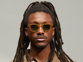 Model is wearing The DAHVEN in Blonde in size 44 with GREEN+ Tinted Lenses