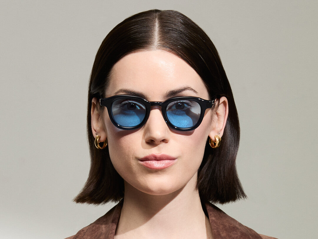 Model is wearing The DAHVEN in Navy in size 44 with Celebrity Blue Tinted Lenses