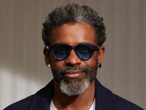 Model is wearing The DAHVEN SUN in Sapphire in size 47 with Celebrity Blue Tinted Lenses