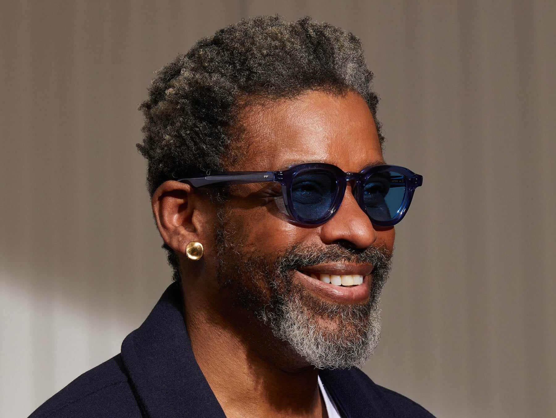 Model is wearing The DAHVEN SUN in Sapphire in size 47 with Celebrity Blue Tinted Lenses