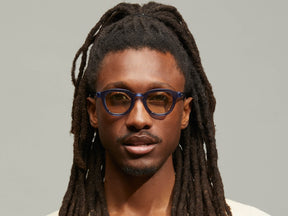 Model is wearing The DAHVEN in Navy size 44 with AMBER+ Tinted Lenses