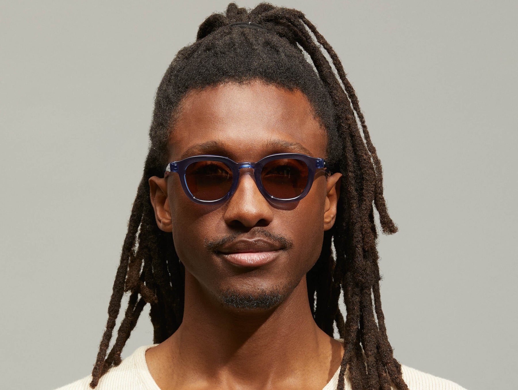 Model is wearing The DAHVEN in Navy size 44 with AMBER+ Tinted Lenses