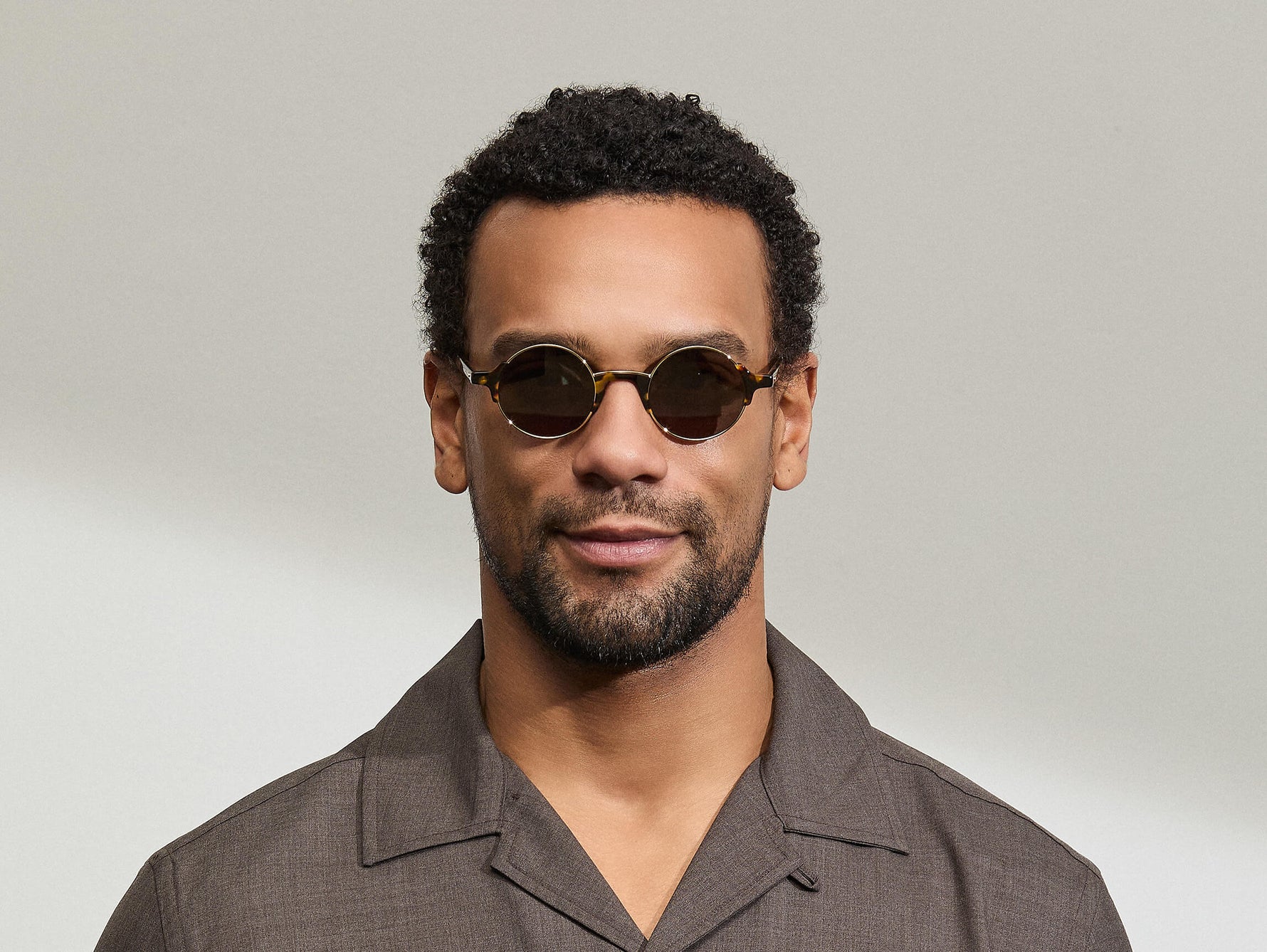 Model is wearing The DIBBIK SUN in size 45 in Tortoise with G-15 Tinted Lenses