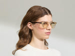 Model is wearing The DOLT in Flesh/Tortoise in size 49 with AMBER+ Lenses