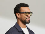 Model is wearing The DOLT in Grey-Brown Fade in size 46 with GREEN+ Lenses