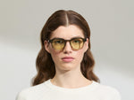 Model is wearing The DOLT in Khaki in size 49 with GREEN+ Lenses