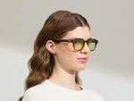 Model is wearing The DOLT in Khaki in size 49 with GREEN+ Lenses
