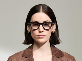 The Model is wearing The DOLT in Black in size 46 with American Grey Fade Tinted Lenses