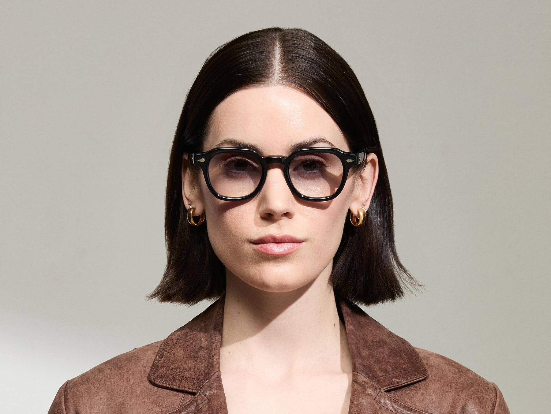 The Model is wearing The DOLT in Black in size 46 with American Grey Fade Tinted Lenses