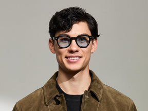 The Model is wearing The DOLT in Black in size 46 with Bel Air Blue Tinted Lenses