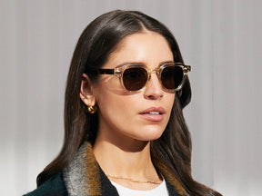 Model is wearing The DOLT SUN in Flesh/Tortoise in size 46 with G-15 Glass Lenses