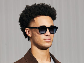 Model is wearing The DOLT SUN in Navy in size 49 with Denim Blue Tinted Lenses