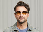 Model is wearing The DOLT SUN in Grey-Brown Fade in size 49 with Chestnut Fade Tinted Lenses