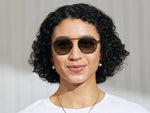 Model is wearing The FANAGLE SUN in Pine in size 53 with Forest Wood Tinted Lenses