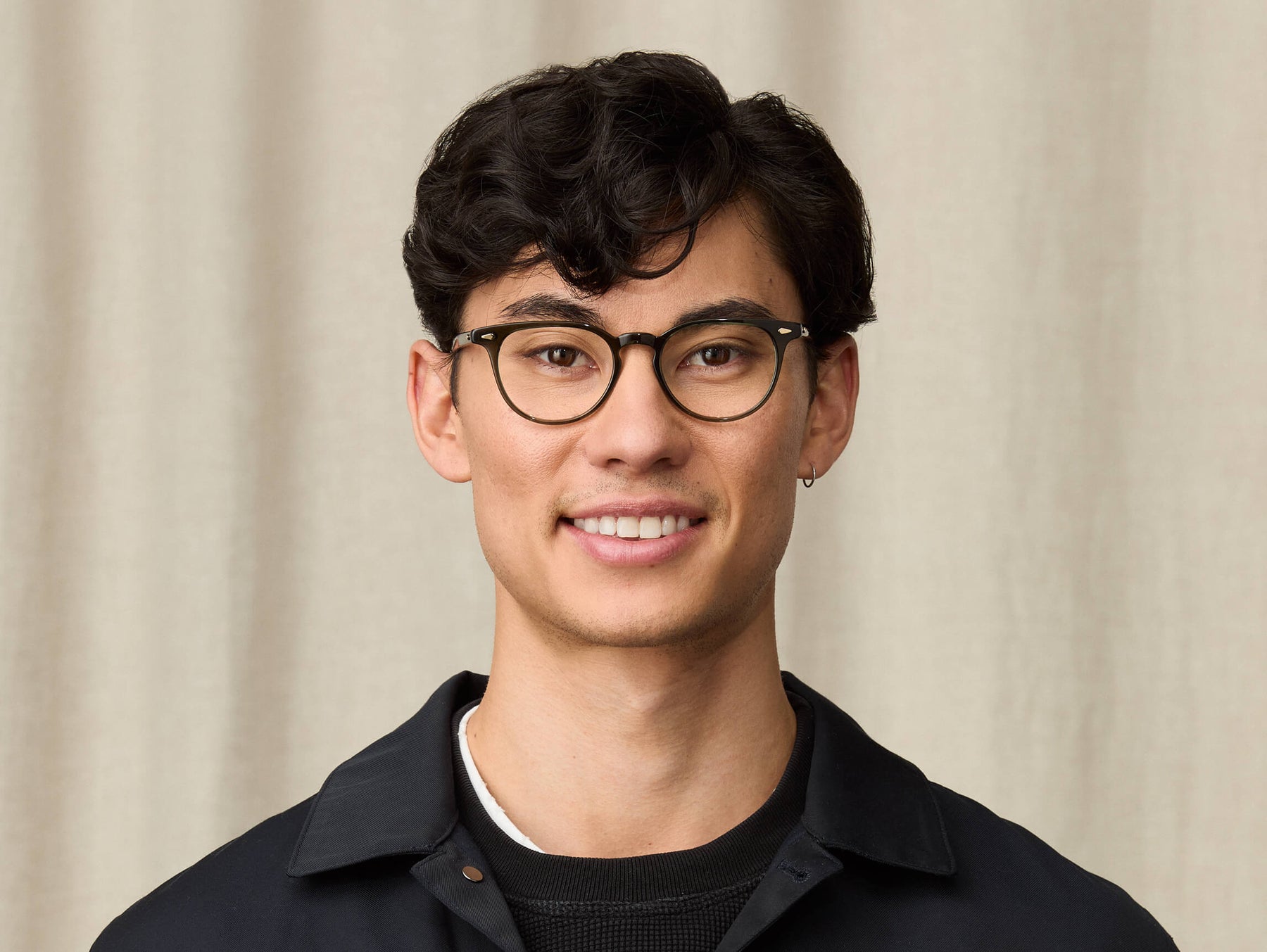 Model is wearing The FEVEL in size 49 in Dark Green