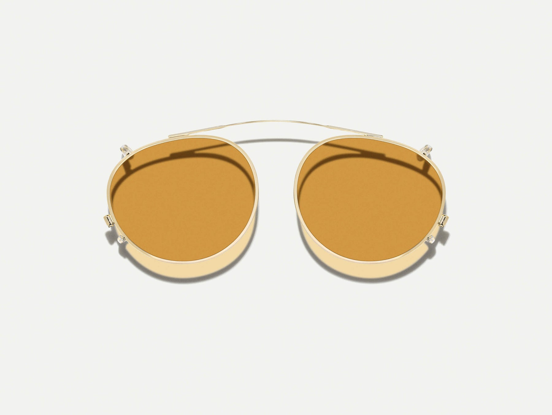 The FRANKIE CLIP  in Gold with Amber Tinted Lenses