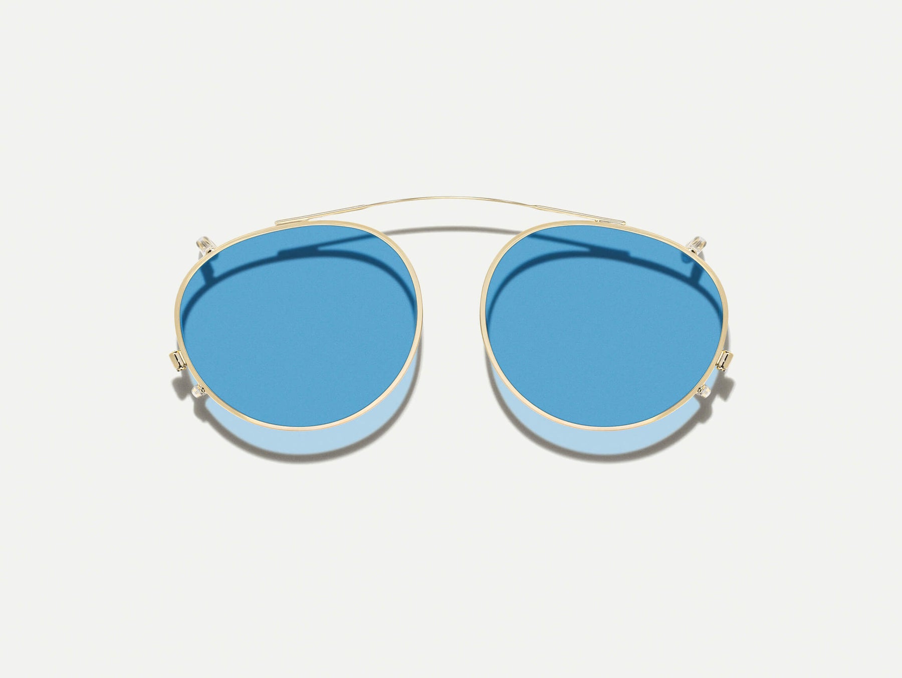 The FRANKIE CLIP  in Gold with Celebrity Blue Tinted Lenses