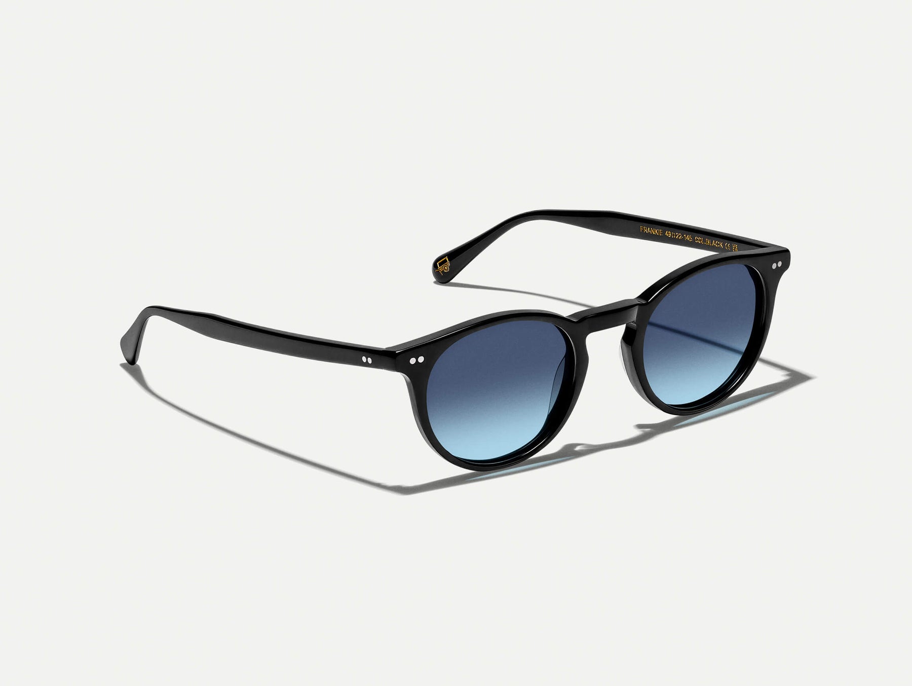 The FRANKIE SUN in Black with Denim Blue Tinted Lenses