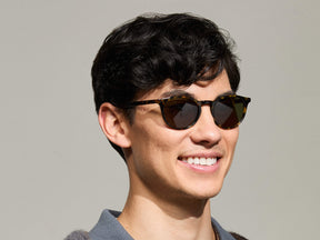 Model is wearing The FRANKIE SUN in Tortoise in size 51 with Ever Green Tinted Lenses