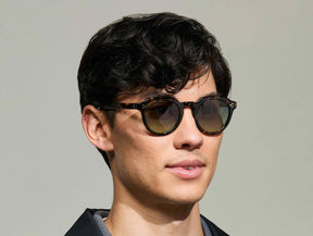 Model is wearing The GAVOLT SUN in Classic Havana in size 48 with Forest Wood Tinted Lenses