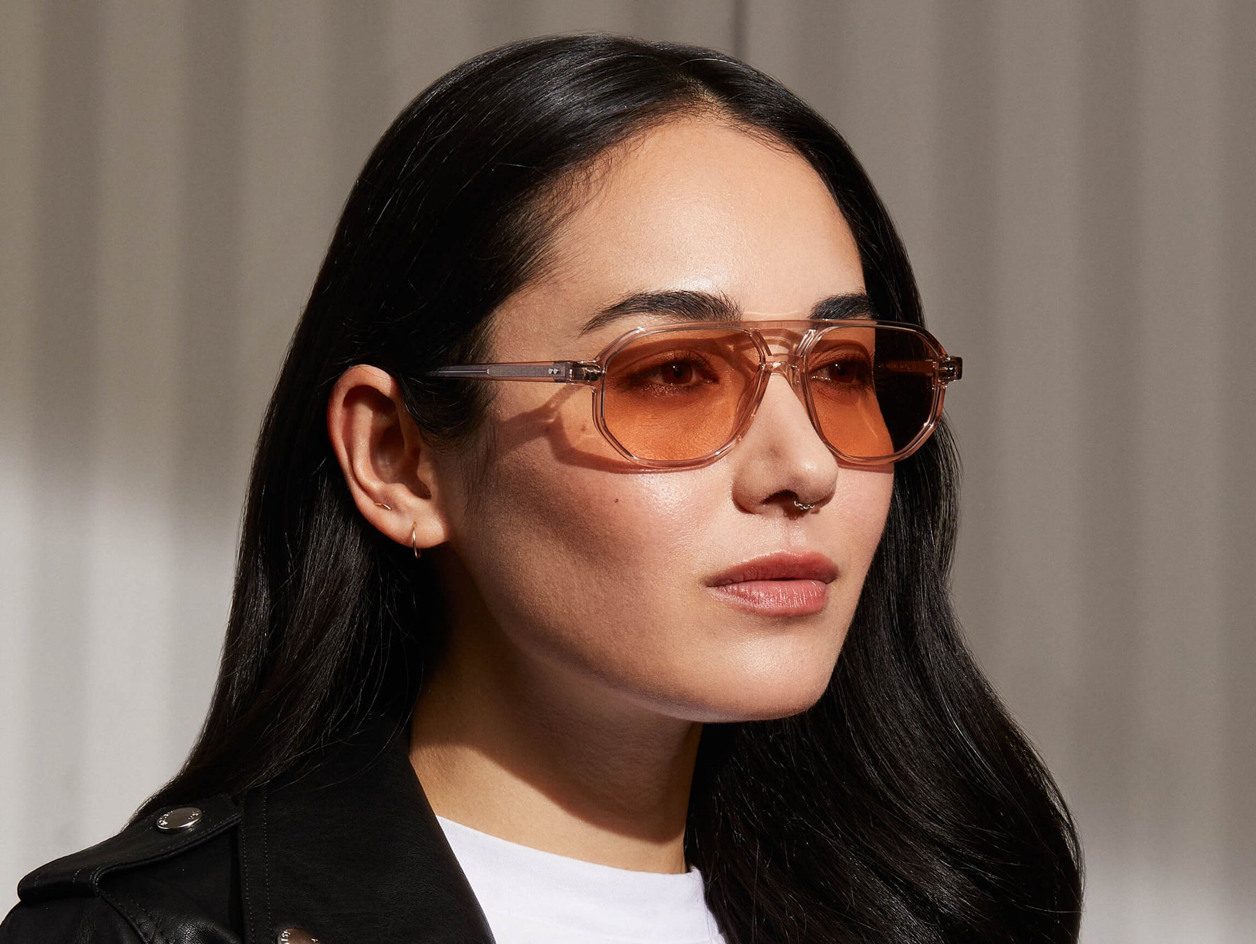 Model is wearing The GAZEEKTAL SUN in Burnt Rose in size 55 with New York Rose Tinted Lenses