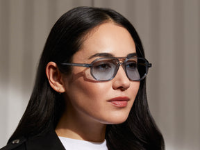 Model is wearing The GAZEEKTAL SUN in Light Blue in size 55 with Bel Air Blue Tinted Lenses