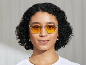 Model is wearing The GELT in Crystal in size 49 with Mellow Yellow Tinted Lenses