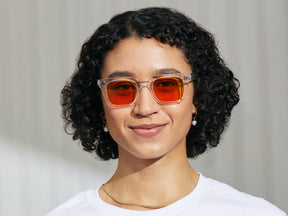 Model is wearing The GROBER in Crystal in size 48 with Woodstock Orange Tinted Lenses