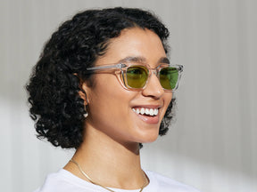 Model is wearing The GROBER in Crystal in size 48 with Garnet Green Tinted Lenses