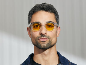 Model is wearing The GROBER in Crystal in size 45 with Mellow Yellow Tinted Lenses