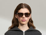 Model is wearing The GROBER SUN in size 48 in Classic Havana with G-15 Tinted Lenses