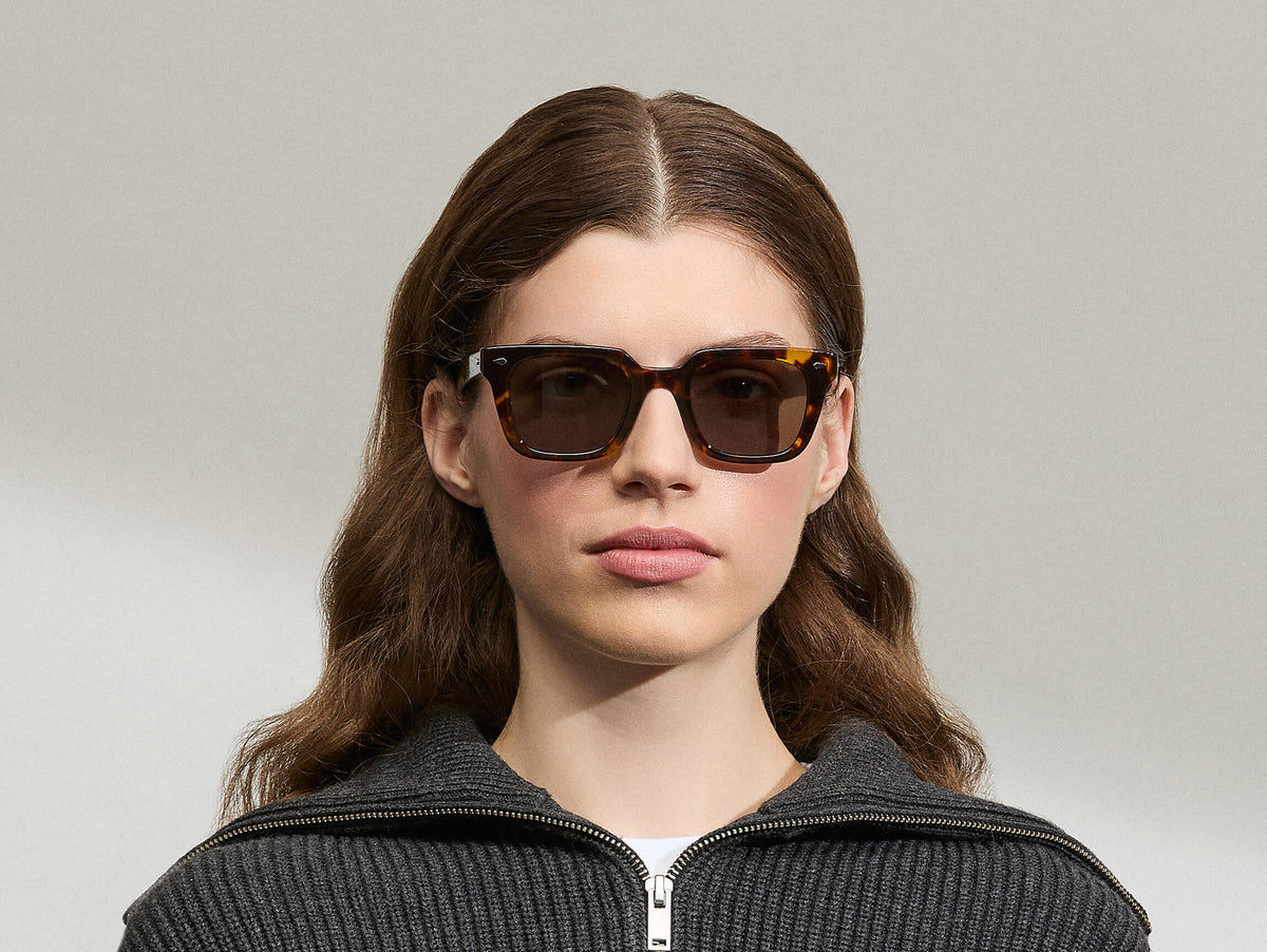 Model is wearing The GROBER SUN in size 48 in Classic Havana with G-15 Tinted Lenses