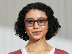 Model is wearing The GROBER SUN in Vintage Rose in size 48 with Bel Air Blue Tinted Lenses