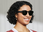 Model is wearing The GRUNYA SUN in Dark Green in size 47 with Calibar Green Glass Lenses