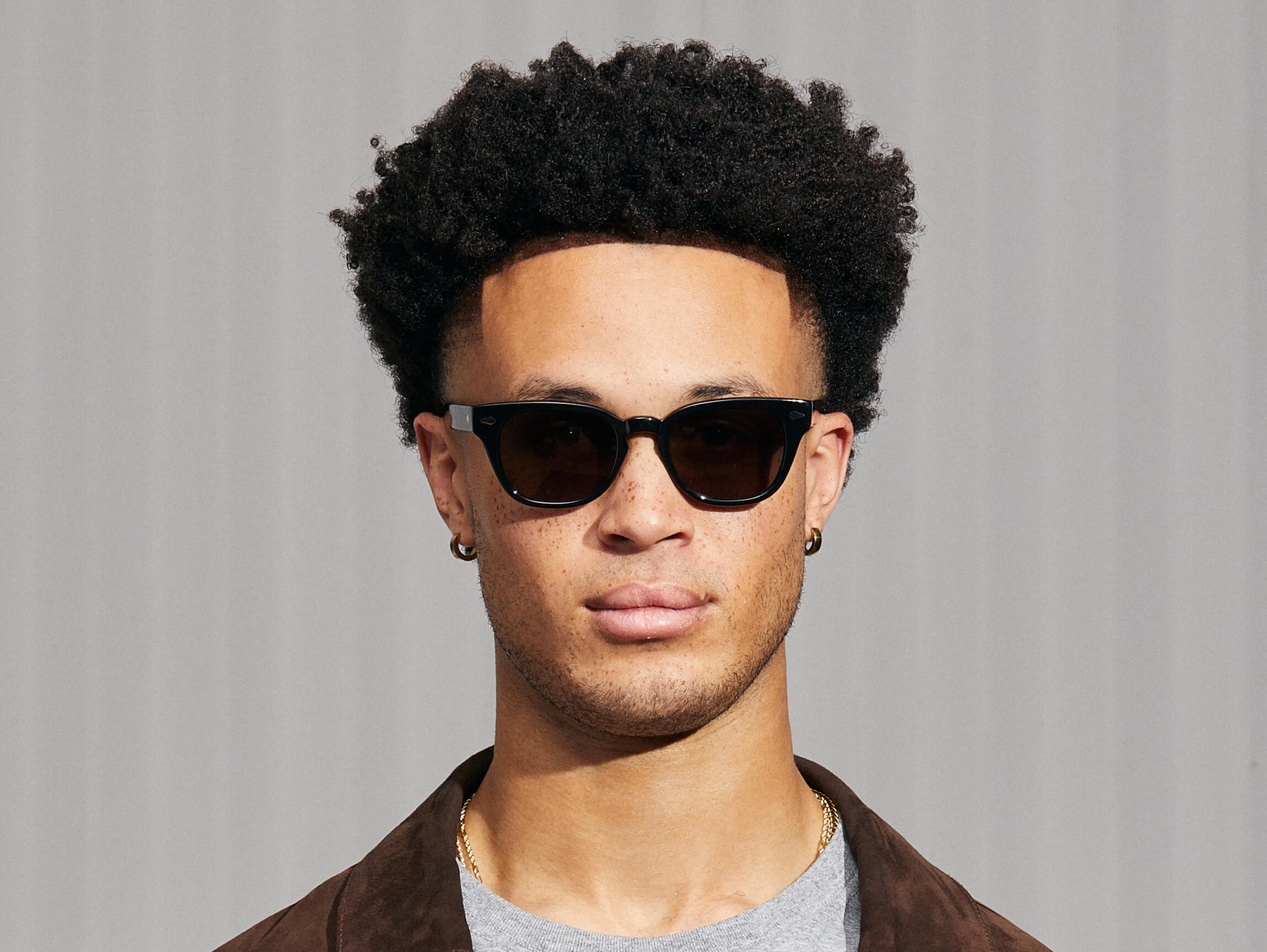 Model is wearing The HAZEN SUN in Black in size 50 with G-15 Glass Lenses