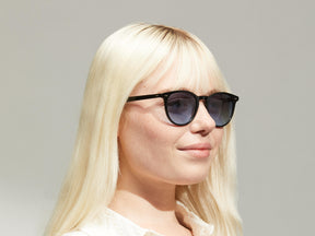 Model is wearing The JARED SUN in size 50 in Black with Denim Blue Tinted Lenses