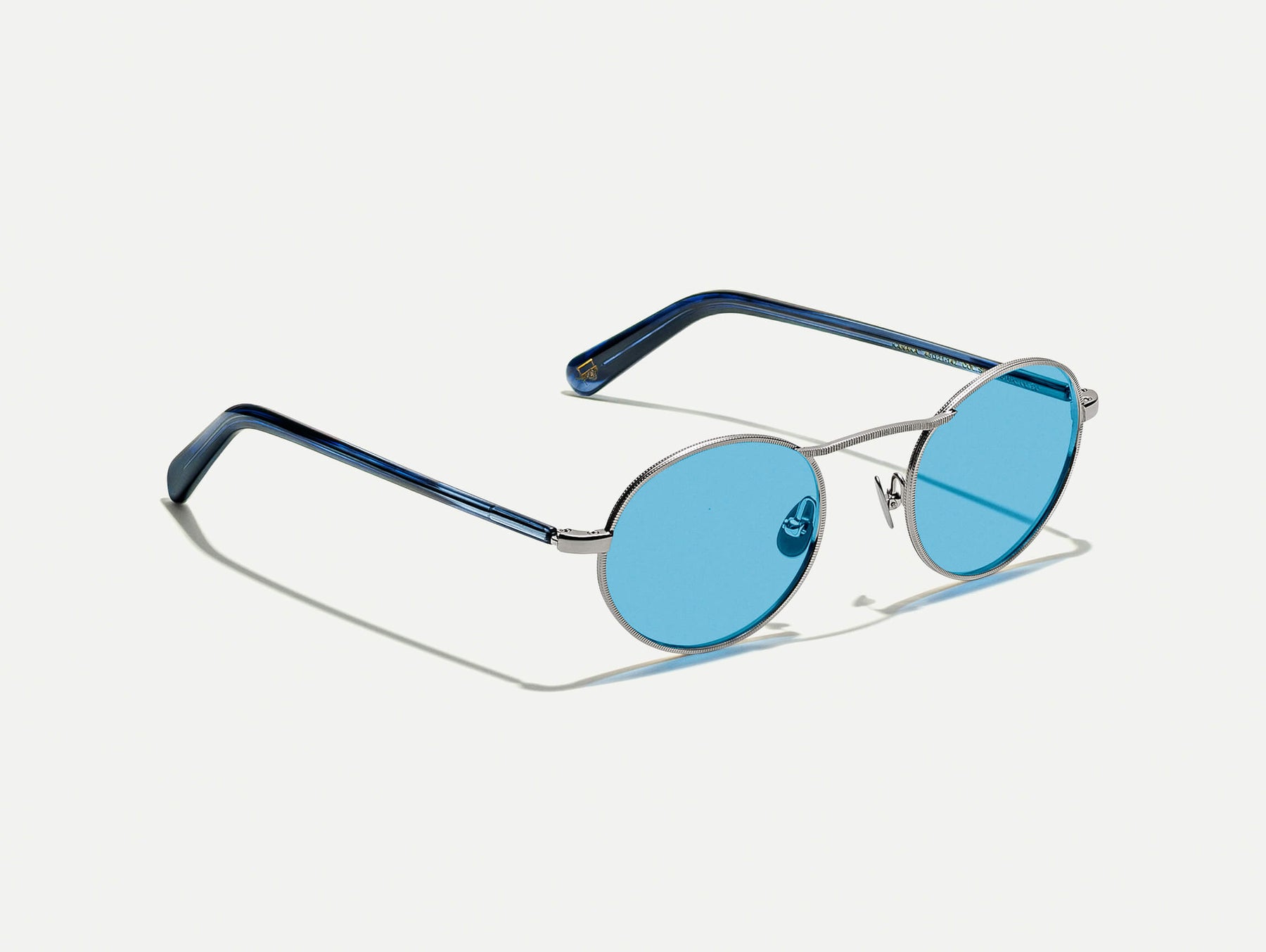 The KANAKA SUN in Silver/Ink with Celebrity Blue Tinted Lenses