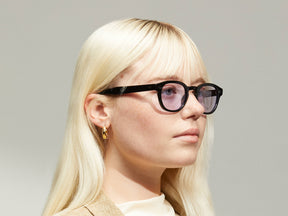Model is wearing The LEMTOSH in Black in size 46 with Lavender Tinted Lenses