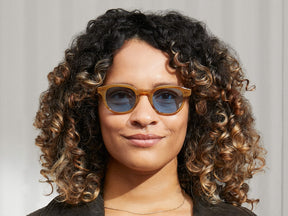 Model is wearing The LEMTOSH in Blonde in size 46 with Celebrity Blue Tinted Lenses