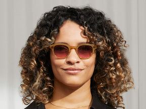 Model is wearing The LEMTOSH in Blonde in size 46 with Westside Sunset Tinted Lenses