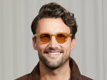 Model is wearing The LEMTOSH in Blonde in size 46 with Amber Tinted Lenses