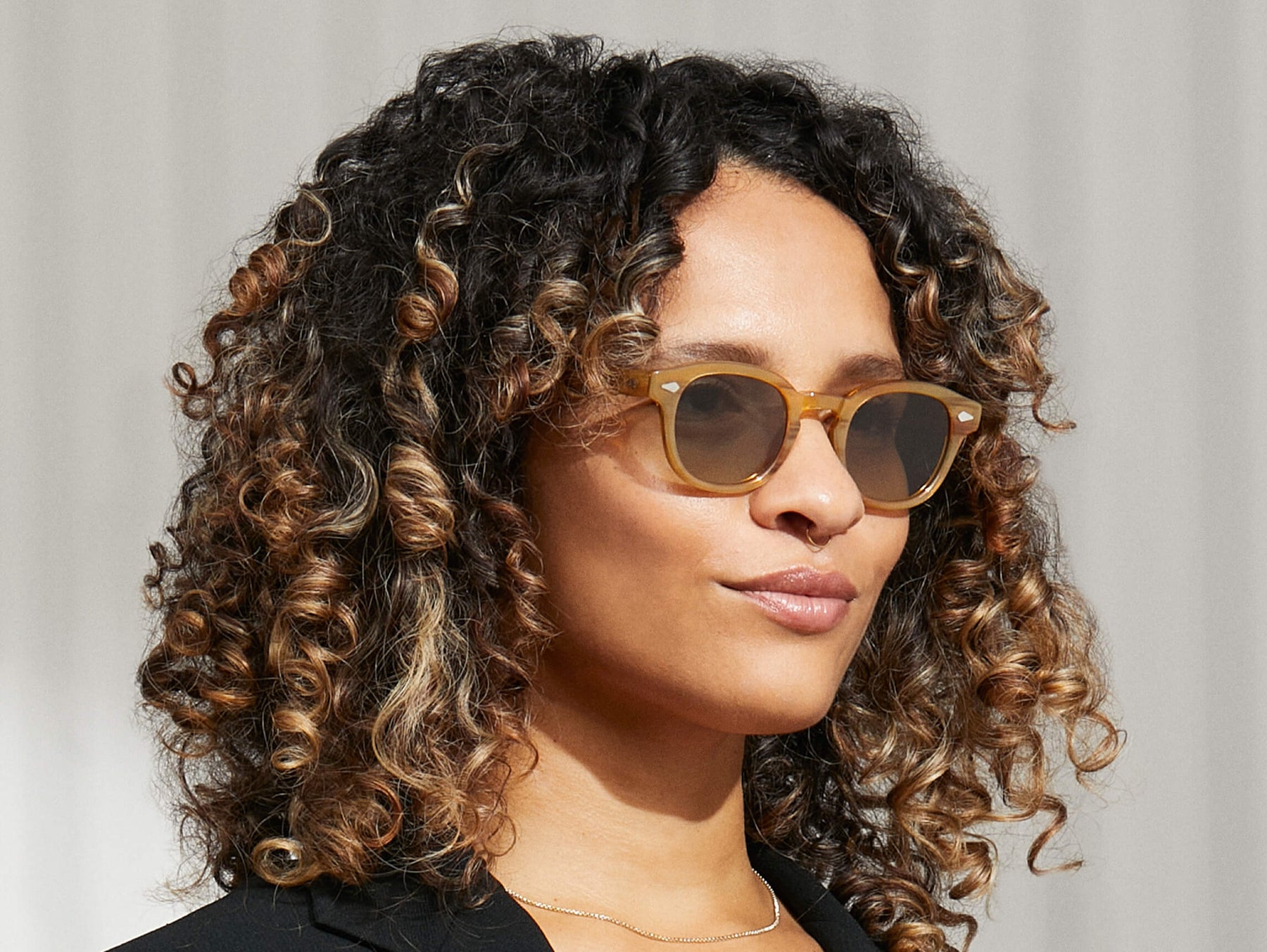 Model is wearing The LEMTOSH in Blonde in size 46 with Forest Wood Tinted Lenses