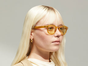 Model is wearing The LEMTOSH in Blonde in size 46 with Pastel Yellow Tinted Lenses