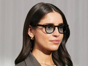 Model is wearing The LEMTOSH in Tortoise in size 46 with BLUE⁺ Tinted Lenses