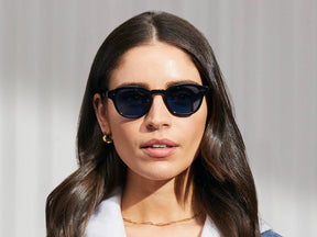 Model is wearing The LEMTOSH in Black in size 49 with BLUE⁺ Tinted Lenses